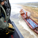 Illustration for article titled This Stranded Ship Is So Perfectly Straight It Seems to Be Sailing On Sand
